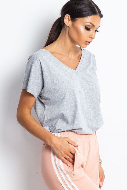 Elegant Women's Short Sleeve T-Shirt with Heart Neckline in grey, woman styled in relaxed settings, projecting an effortless fashionable choice.