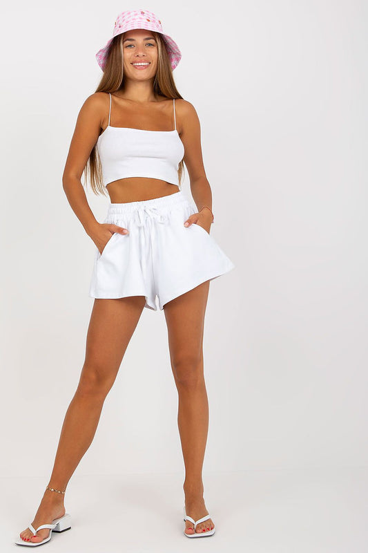 Elegant Women's Wide Leg Shorts by Rue Paris, paired with a stylish crop top and featuring slip pockets, redefining modern casual elegance on a sunny day.