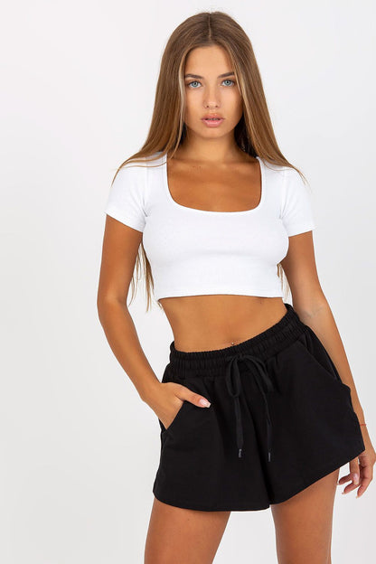 Elegant Women's Wide Leg Shorts by Rue Paris – Cotton Spandex Blend with Slip Pockets, model showcasing stylish black shorts paired with a fitted white crop top.