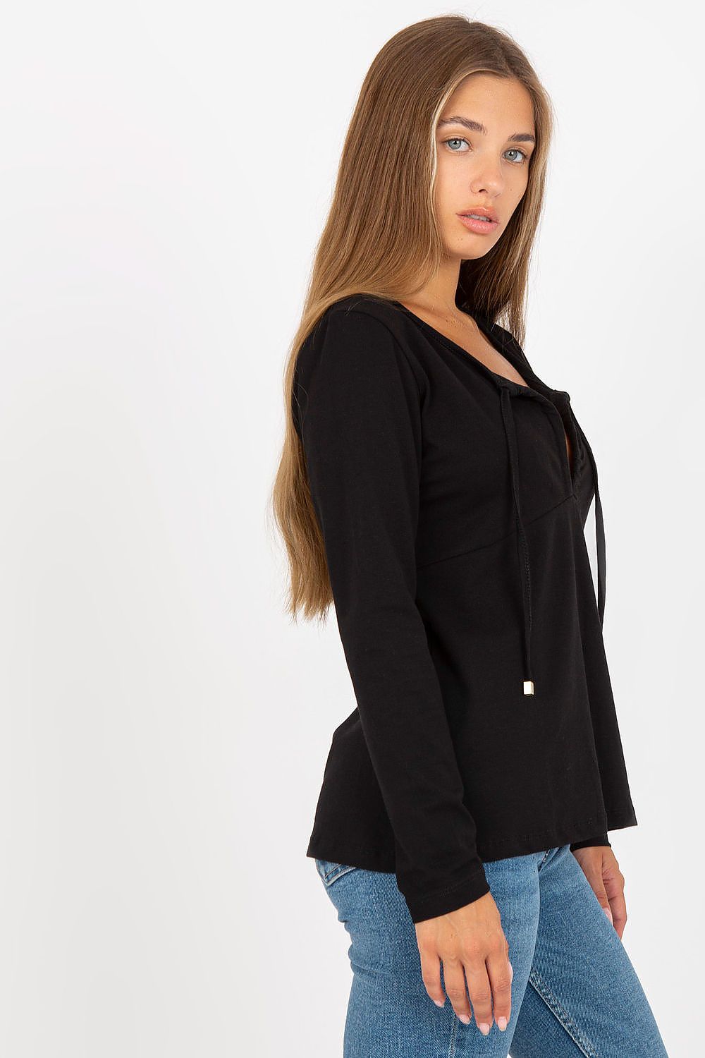 Elegant Long Sleeve Blouse By Rue Paris With Deep Neckline And Binding Detail, portrayed by a model showing the side view, demonstrating its chic style and fit.
