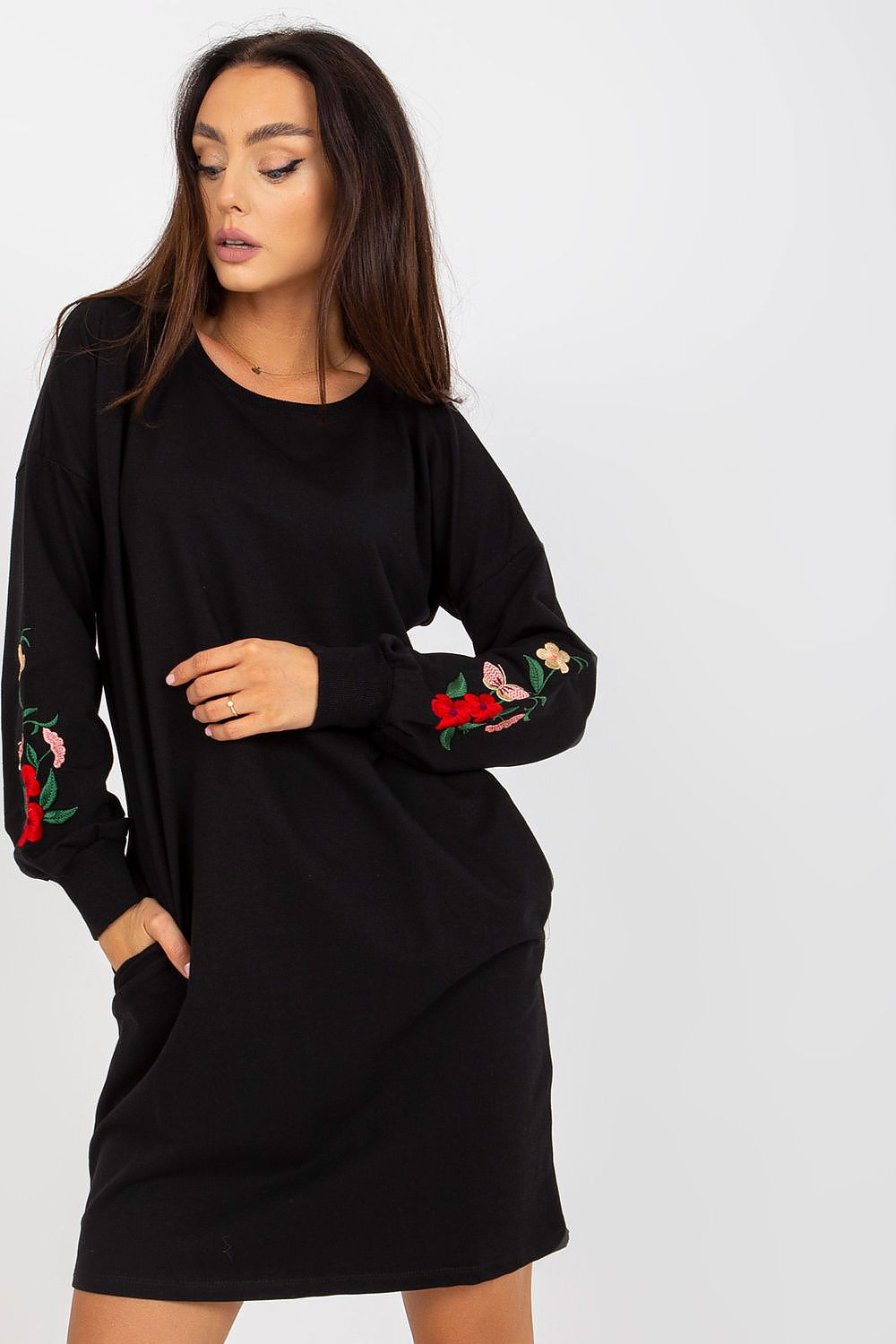 Elegant Cotton Spandex Tracksuit Dress with Embroidered Sleeves and Side Pockets - Rue Paris, showcasing intricate floral embroidery on sleeves, worn by a model with a relaxed pose.