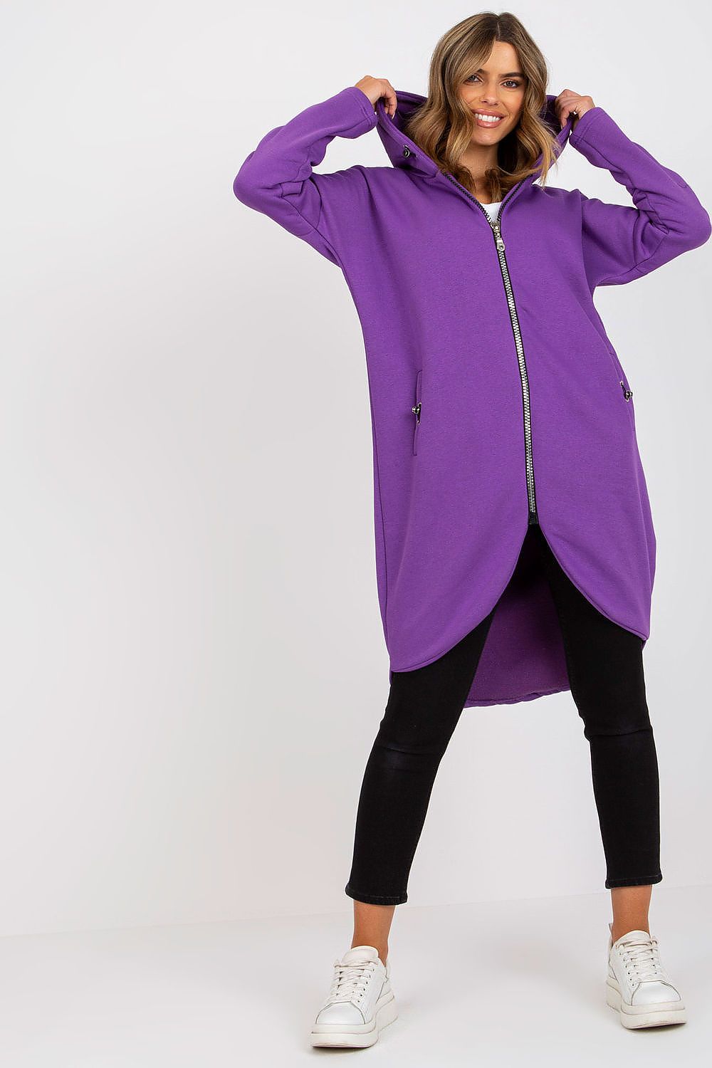 Rue Paris Zip-Up Extended Cut Sweatshirt with Hood and Side Pockets in vibrant purple, designed for comfort and style, featuring a zippered front and stylish long sleeves.