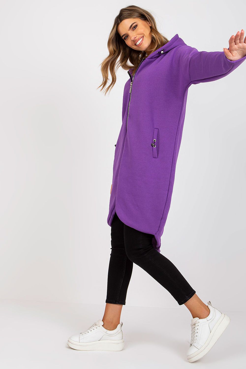 Luxurious Rue Paris Zip-Up Extended Cut Sweatshirt with Hood and Side Pockets showcased in a dynamic pose, highlighting its chic purple colour and modern silhouette.