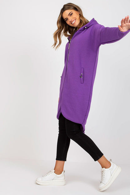 Luxurious Rue Paris Zip-Up Extended Cut Sweatshirt with Hood and Side Pockets showcased in a dynamic pose, highlighting its chic purple colour and modern silhouette.
