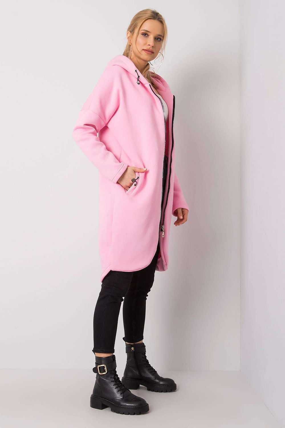 Rue Paris Zip-Up Extended Cut Sweatshirt with Hood and Side Pockets in pink, elegantly styled with a chic silhouette, designed for contemporary fashion enthusiasts.