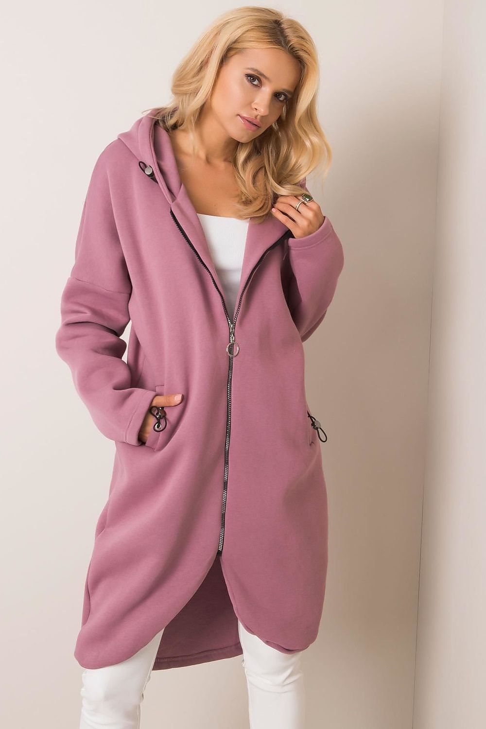 Rue Paris Zip-Up Extended Cut Sweatshirt with Hood and Side Pockets, displayed in a soft pink tone, ideal for a luxe, comfortable style.