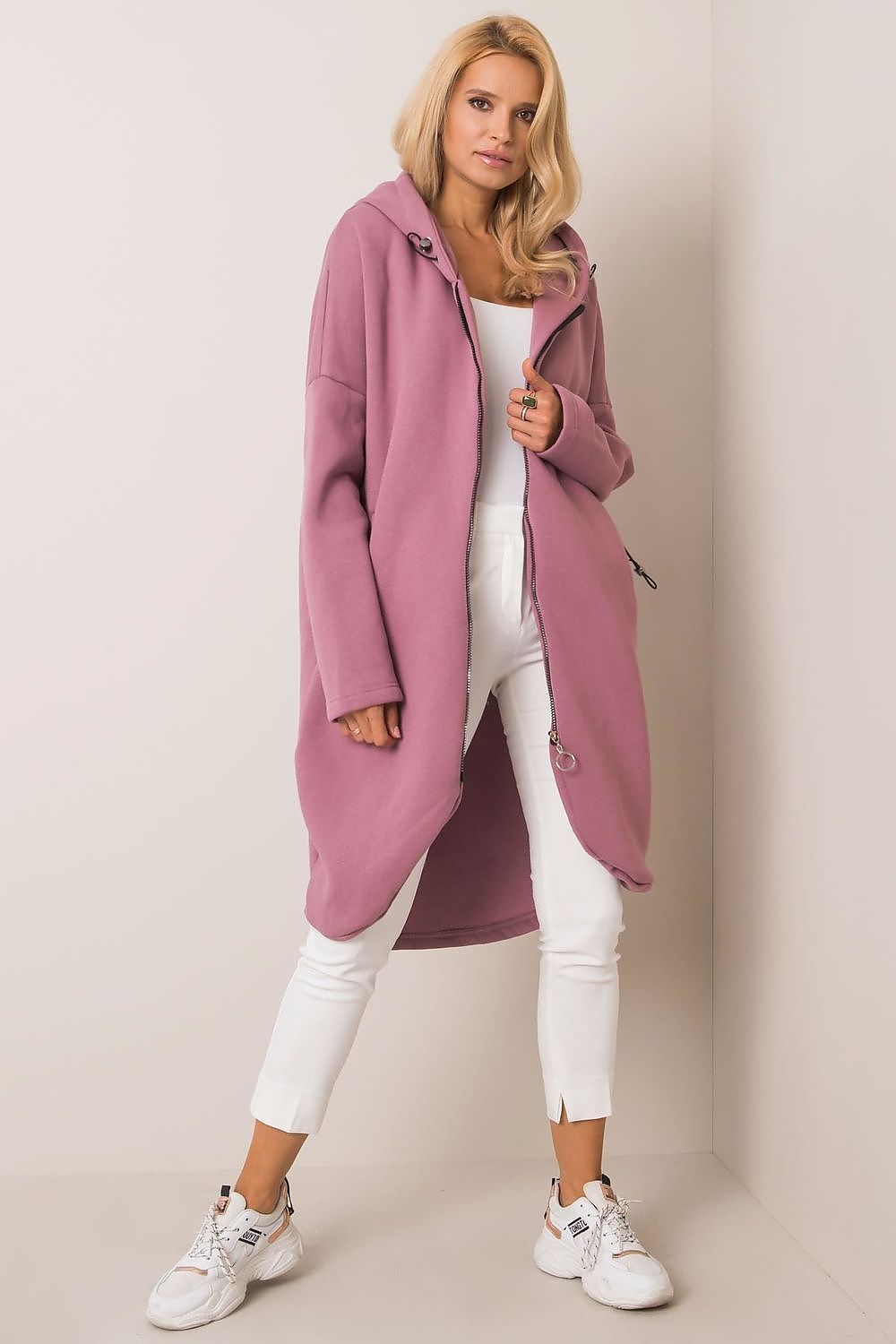 Rue Paris Zip-Up Extended Cut Sweatshirt with Hood and Side Pockets, beautifully modelled in pink, offering a contemporary and fashionable vibe.