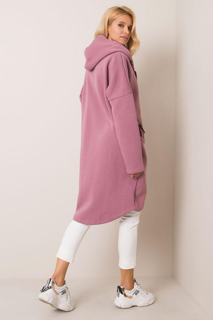 Rue Paris Zip-Up Extended Cut Sweatshirt with Hood and Side Pockets in soft mauve, stylishly worn by a model showcasing its generous length and relaxed fit, perfect for a luxurious casual look.
