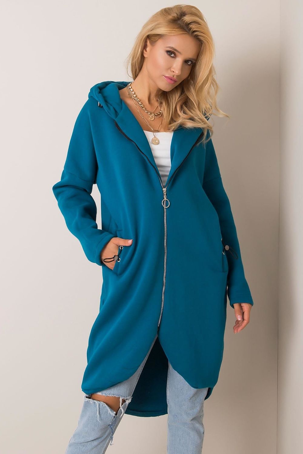 Rue Paris Zip-Up Extended Cut Sweatshirt with Hood and Side Pockets displayed in vibrant ocean blue, elegantly styled by a model highlighting its contemporary design and cosy appeal.