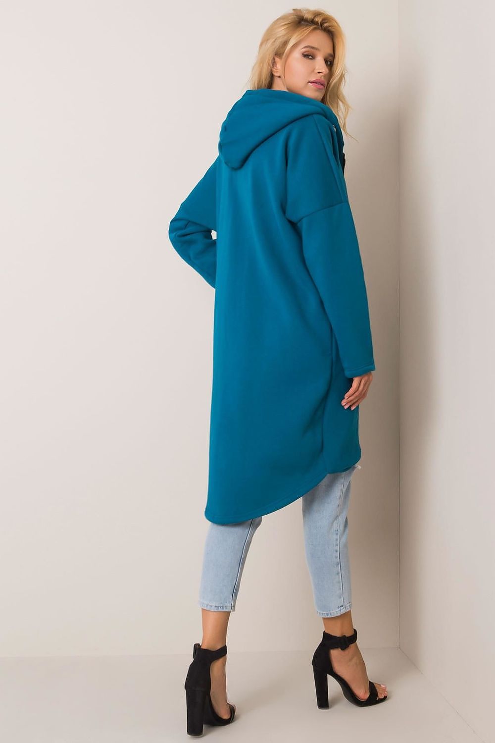 Rue Paris Zip-Up Extended Cut Sweatshirt with Hood and Side Pockets in ocean blue, modeled gracefully to highlight its flattering silhouette and luxurious fabric blend, ideal for modern elegance.