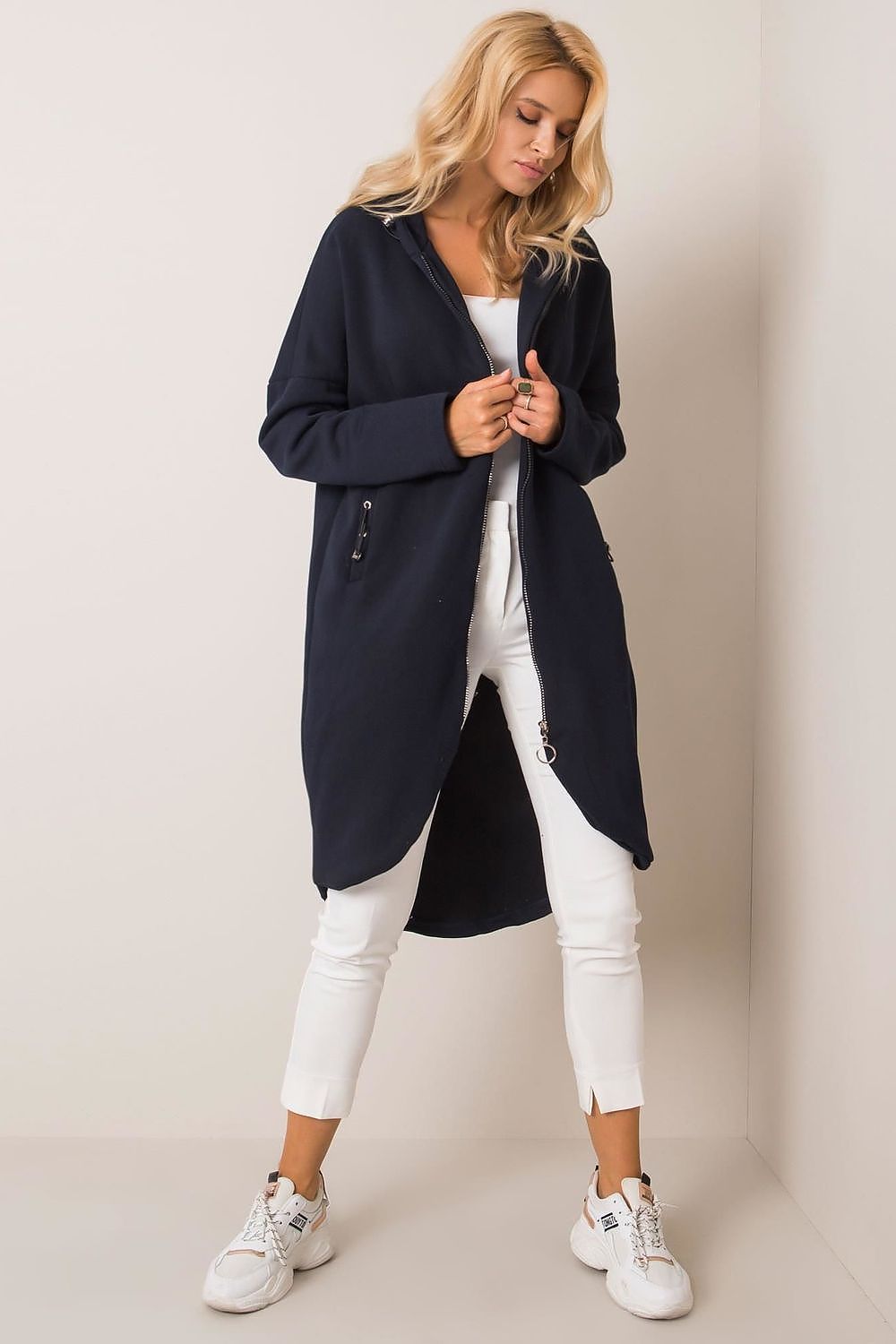 Elegantly styled Rue Paris Zip-Up Extended Cut Sweatshirt with Hood and Side Pockets, model showcasing a chic navy colour, perfect for a sophisticated casual look.