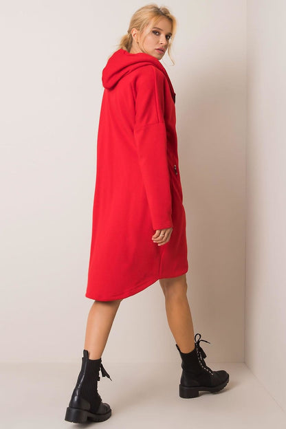 Sophisticated rear view of a model adorned in the red Rue Paris Zip-Up Extended Cut Sweatshirt with Hood and Side Pockets, perfectly paired with chic black boots for a luxe finish.