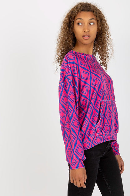Side view of Rue Paris Women's Long Sleeve Sweatshirt with kangaroo pocket, highlighting its unique pattern and stylish silhouette worn by a fashionable model.