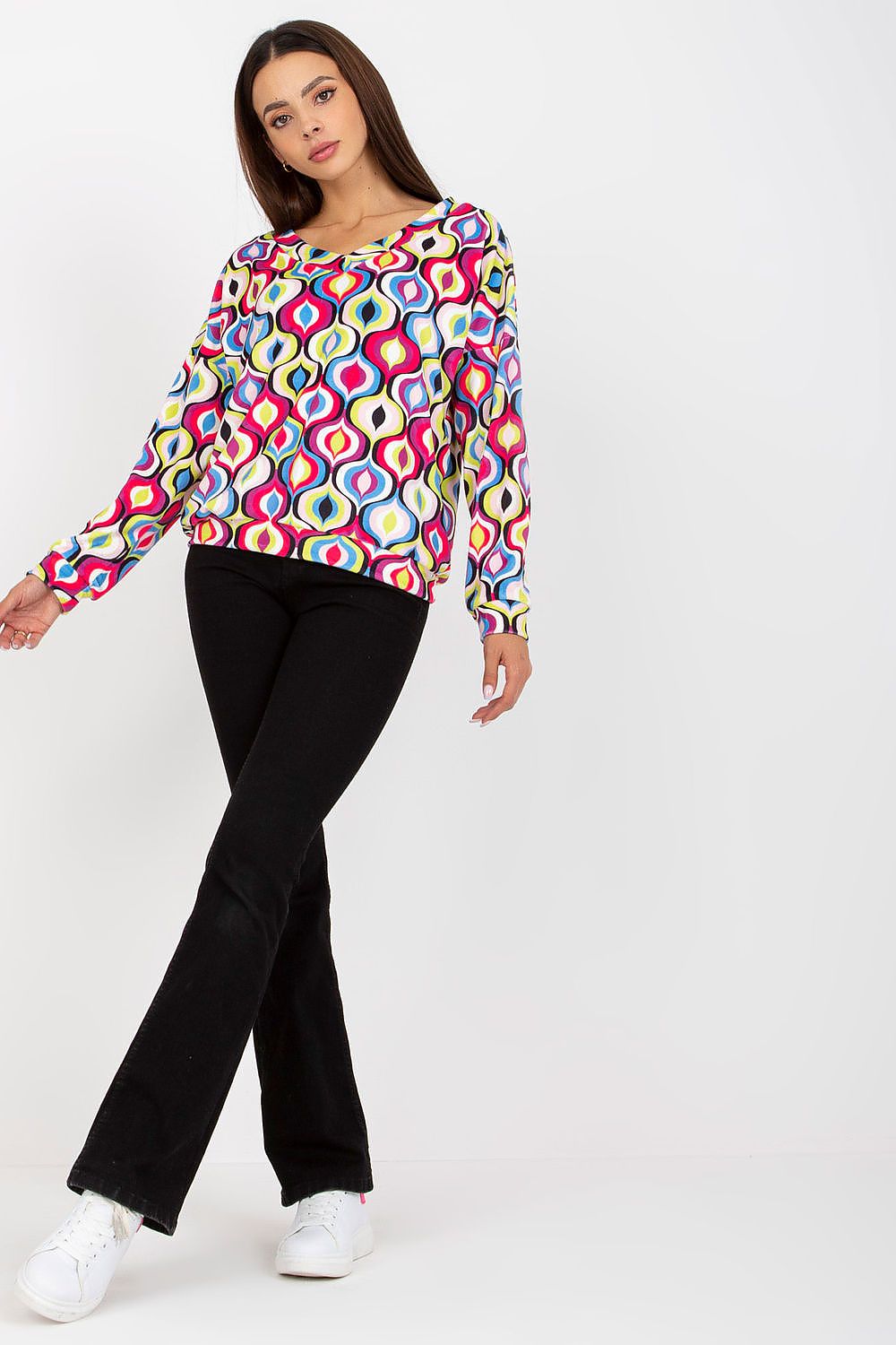 Luxurious Women's Sweatshirt with Heart Neckline and Unique Pattern by Rue Paris, model showcasing vibrant fashion style with multicolour design and casual black flared pants.