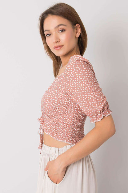 Chic side view of the Rue Paris Fitted Cotton Spandex Blouse with V-Neck and Short Sleeves, highlighting its fitted silhouette and delicate puffed sleeves.