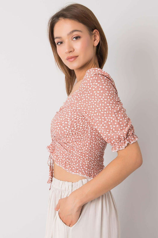 Chic side view of the Rue Paris Fitted Cotton Spandex Blouse with V-Neck and Short Sleeves, highlighting its fitted silhouette and delicate puffed sleeves.