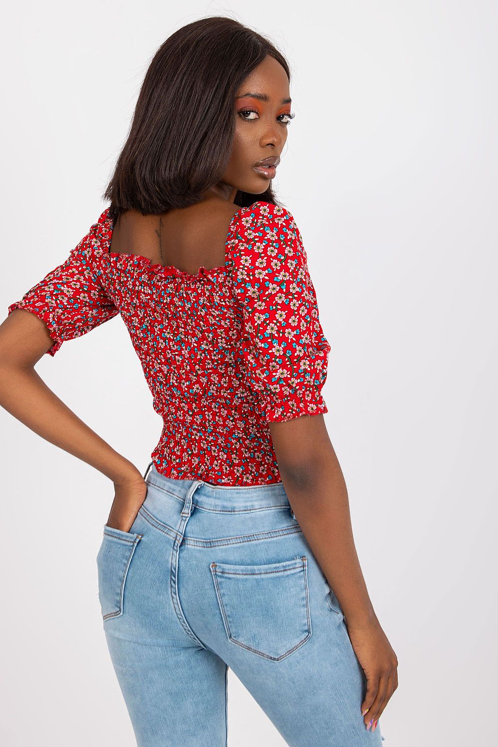 Stylishly designed, the fitted short sleeve v-neck blouse in 100% viscose by Rue Paris highlights elegant detailing and comfort, perfect for any upscale attire.
