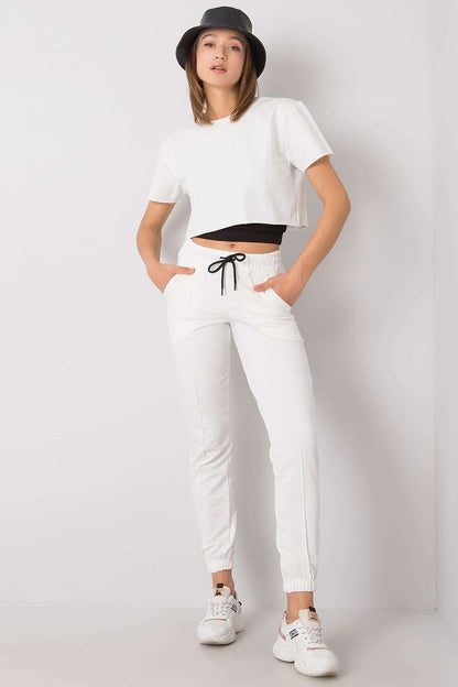 Elegantly styled Rue Paris Women's 3-Piece Set featuring a chic cotton blend white sweatshirt, matching white trousers with an elastic waistband, and a contemporary black crop top. Perfect for sophisticated casual wear.