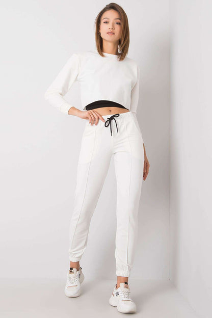 Elegantly styled Rue Paris Women's Designer Trousers Set featuring a matching cropped sweatshirt and tailored trousers in chic white. Ideal for a sophisticated casual look.