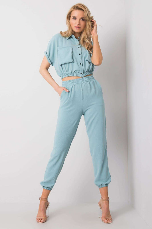 Rue Paris Women's Elegant Trousers Set featuring a stylish blouse and comfortable pants, showcasing a sophisticated light blue ensemble with pockets, perfect for luxurious casual wear.