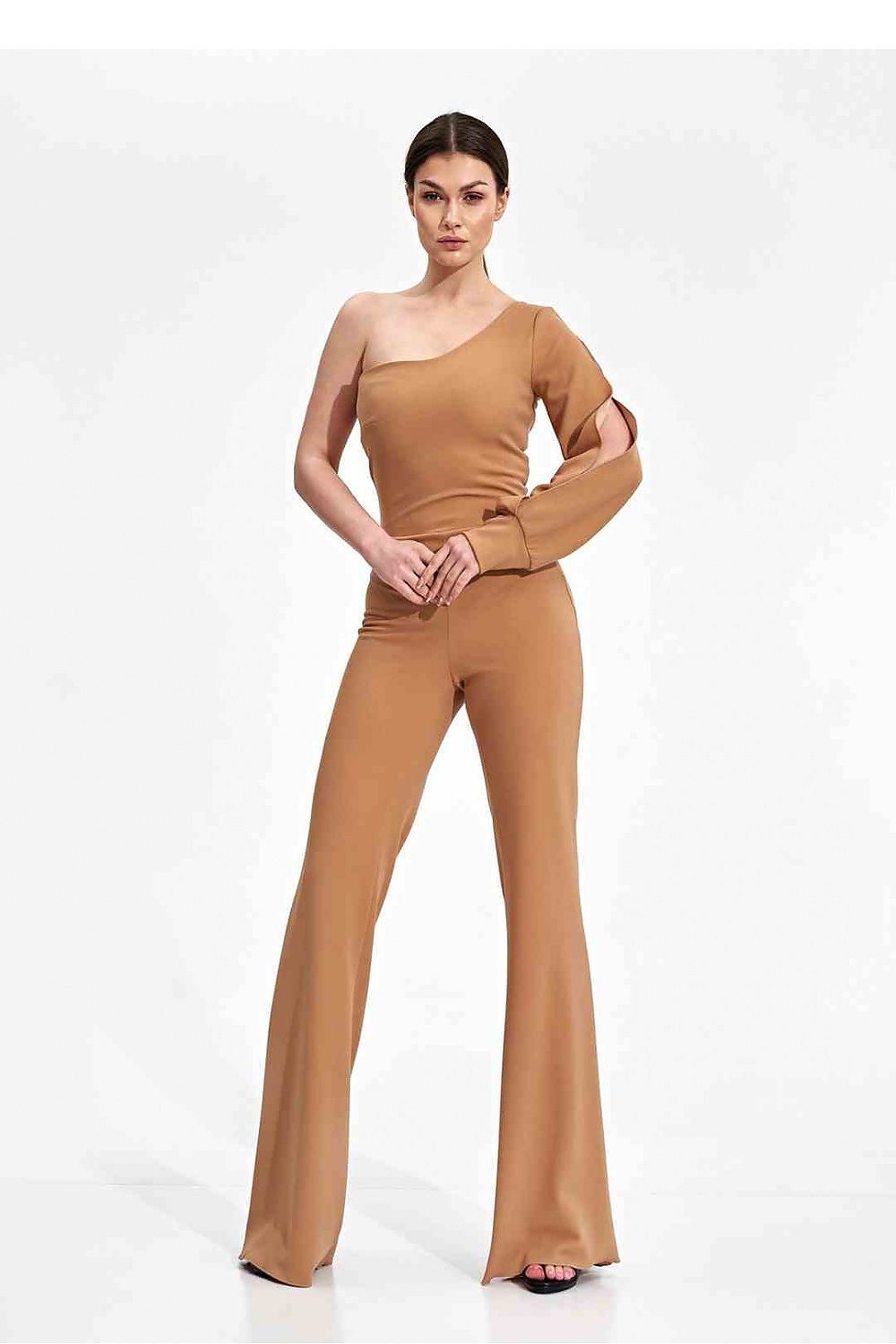 Elegant Figl Jumpsuit With Long Sleeve, Slit Cuff & Wide Legs - A model presenting a sophisticated brown jumpsuit featuring one long sleeve and decorative slit cuffs, ideal for luxurious occasions.