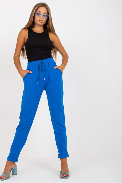 Luxury Women's High-Waisted Sweatpants with Slip Pockets worn with a fitted black tank top, exuding elegance and comfort.
