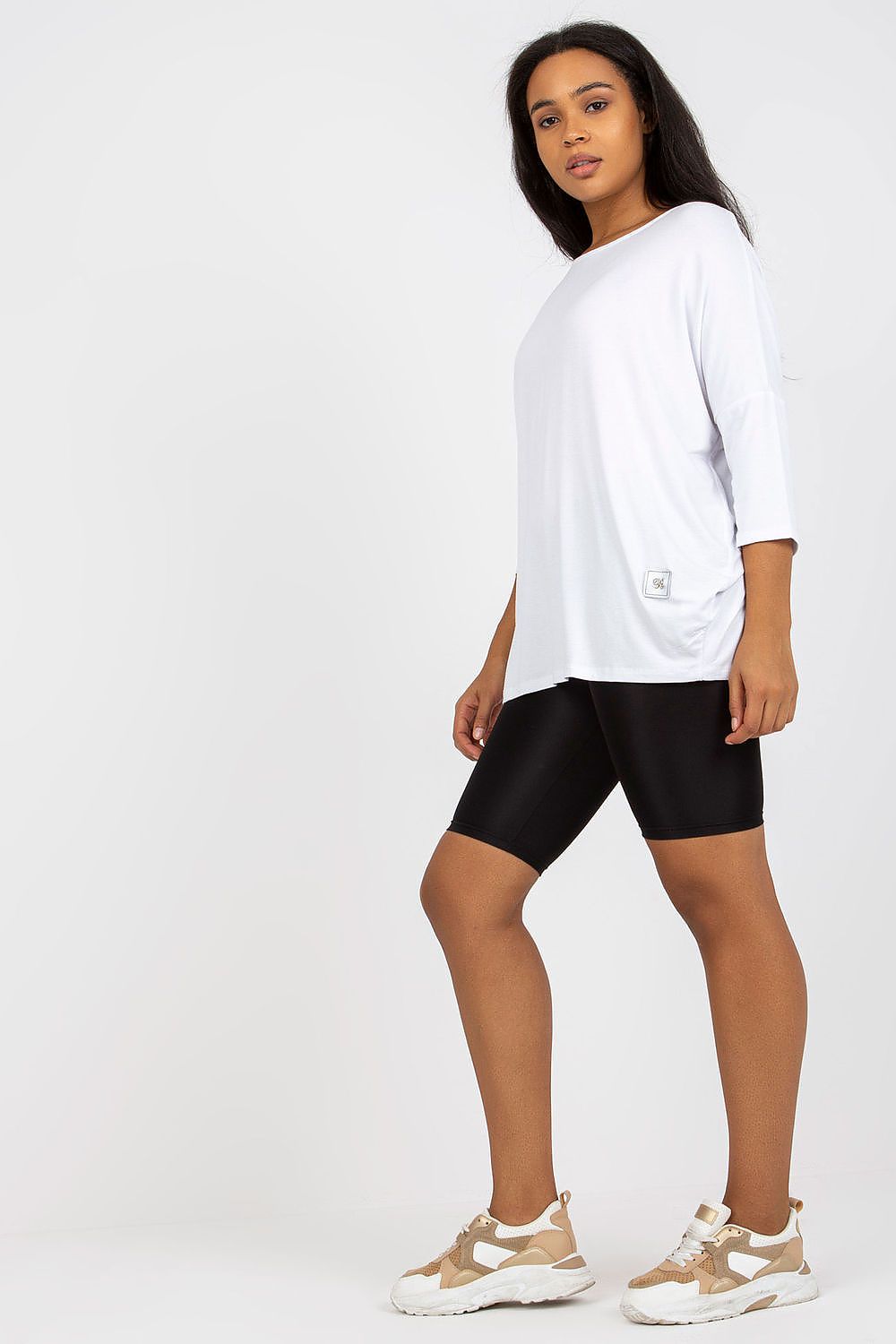 Luxury plus size blouse with 3/4 sleeves and boat neckline in cotton and spandex blend, showcased in white with black shorts.