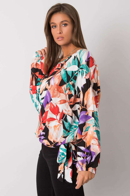 Ex Moda Loose Fit Long Sleeve Blouse with Round Neckline and Decorative Binding, elegantly styled with a floral design in rich colours, displayed by a model who exudes sophistication and charm.