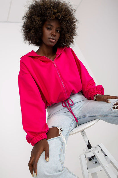 Luxury Women’s Hooded Zippered Sweatshirt by Rue Paris in hot pink, elegantly paired with distressed denim jeans, combining comfort and style for fashionable women.