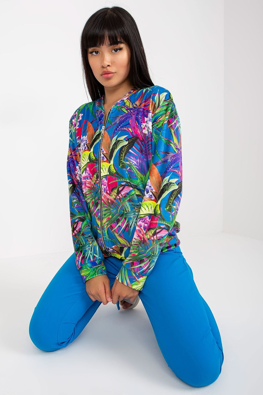 Rue Paris Women's Long-Sleeved Zippered Sweatshirt With Pockets, showcasing a vibrant floral design, perfect for stylish and comfortable casual wear.