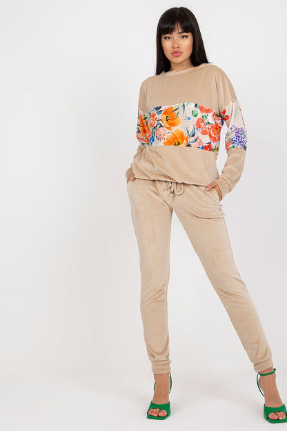 Stunning portrayal of the Chic Rue Paris 2-Piece Set in a soft beige floral sweatshirt with matching tailored long pants, elegantly made from a viscose-spandex blend for a luxurious feel.