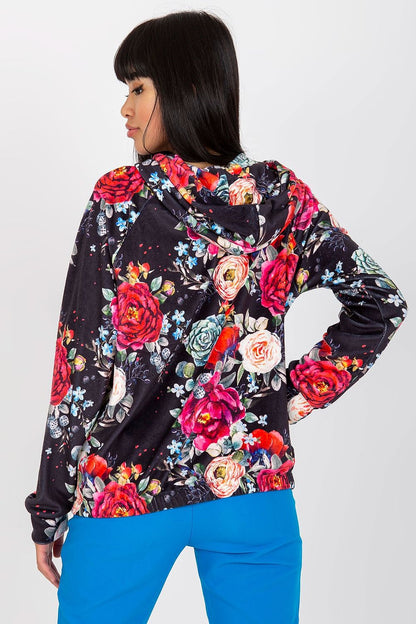 Luxurious Rue Paris Women's Hooded Zip Sweatshirt with Pockets showcased in a floral design, featuring vibrant roses on a dark background, worn by a model with long hair, exuding elegance and comfort in sizes S/M & L/XL.