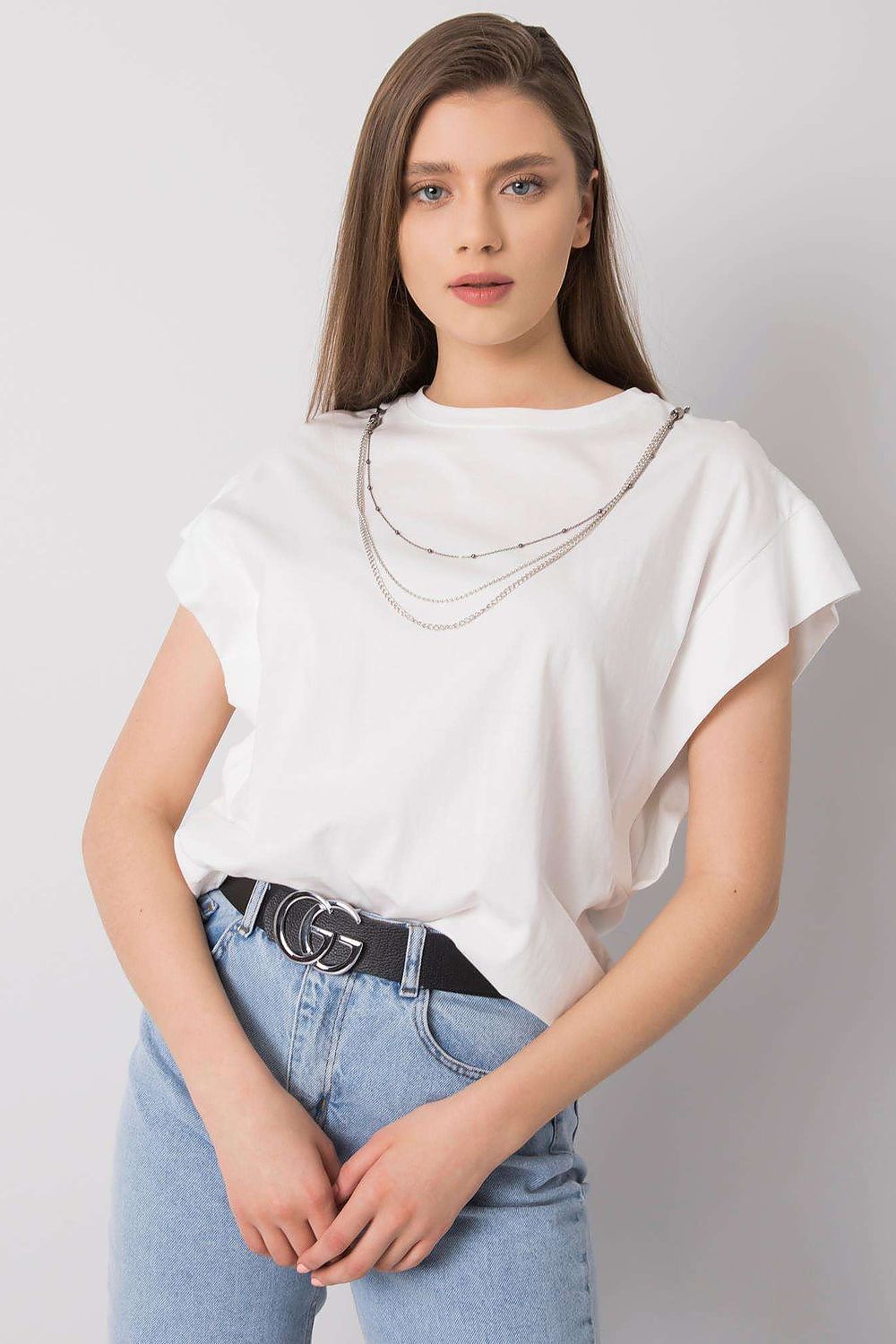 Rue Paris Luxurious Loose Fit Blouse in pristine white, worn by a model, featuring short sleeves and a detachable chain, epitomising sophistication and effortless style.