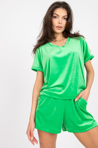 Luxury Velour Blouse And High-Waisted Short Set With Heart Neckline by Rue Paris, showcasing a model with a soft green velour outfit, displaying sophisticated elegance with short sleeves and a relaxed fit.