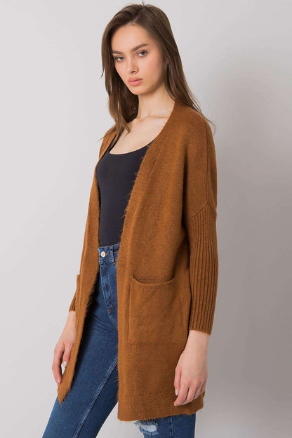 Elegant Long-Sleeved Rue Paris Cardigan with Slip Pockets – Chic Layering Essential in Acrylic Blend, on display in a flattering silhouette, ideal for an upscale casual look.