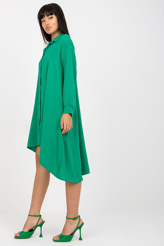 Side view of the Long-Sleeved Asymmetrical Button-Down Shirt Dress by Italy Moda in a vibrant green, highlighting its chic design and luxurious fabric suitable for sophisticated everyday occasions.
