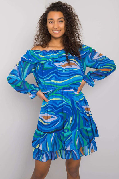 Stunning elegant long sleeve dress with frill hem and Spanish neckline by Italy Moda, showcased on a model with curly hair and a joyful smile, featuring a vibrant blue and green abstract pattern, ideal for a chic summer outing.