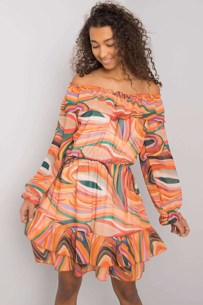 Elegant Long Sleeve Dress with Frill Hem and Spanish Neckline by Italy Moda, featuring vibrant swirls of orange and green patterns, model showcases dress with playful charm.