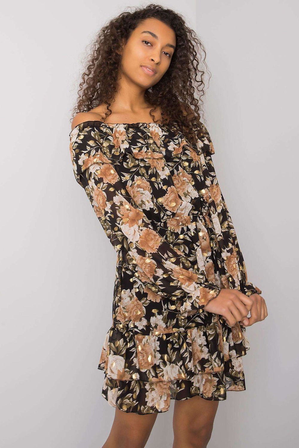 Elegant Long Sleeve Dress with Frill Hem and Spanish Neckline by Italy Moda, featuring a stunning floral pattern, model posing with confidence against a soft grey backdrop.