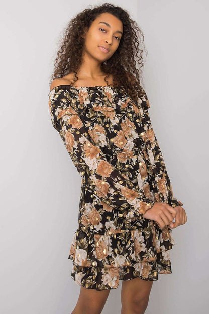 Elegant Long Sleeve Dress with Frill Hem and Spanish Neckline by Italy Moda, featuring a stunning floral pattern, model posing with confidence against a soft grey backdrop.