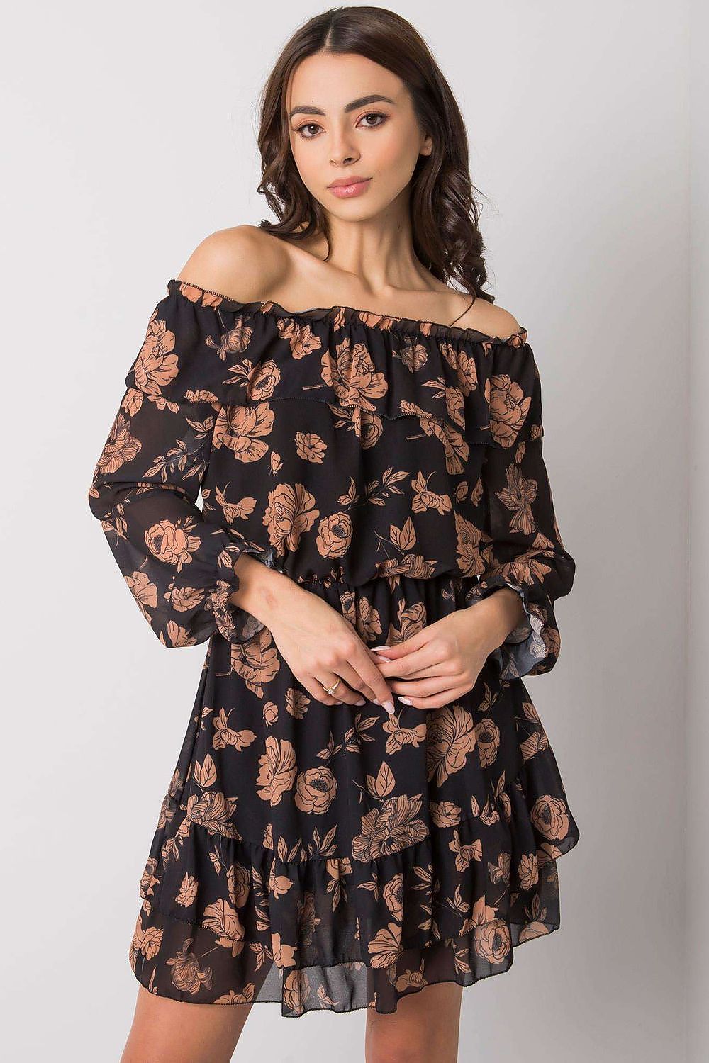 Front view of the Elegant Long Sleeve Dress with Frill Hem and Spanish Neckline by Italy Moda, model elegantly posing with floral details, exuding luxury and style.