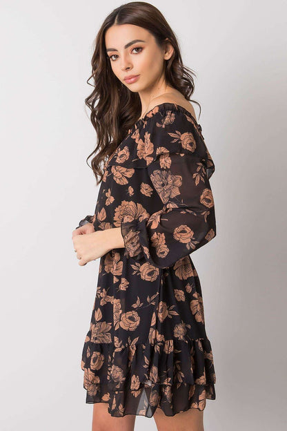 Elegant Long Sleeve Dress with Frill Hem and Spanish Neckline by Italy Moda, showcased by a model in a floral black design, perfect for a stylish evening out.