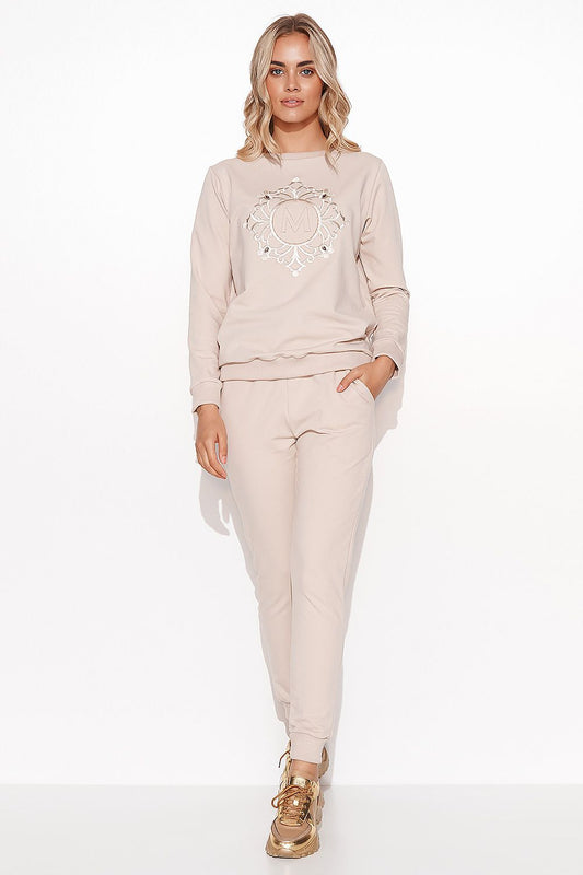 Elegant Women's Makadamia Sweatshirt Set with Crystal Detail and Comfortable Long Pants, model wearing a stylish beige sweatshirt with crystal embellishments and matching long pants.