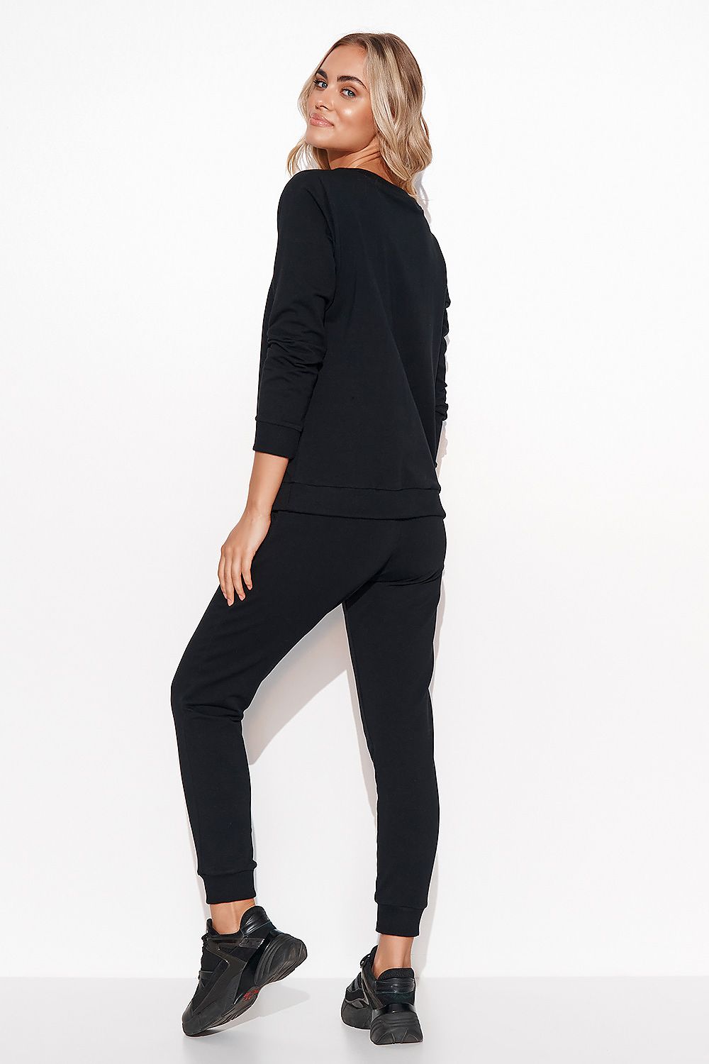 Elegant Women's Makadamia Sweatshirt Set with Crystal Detail and Comfortable Long Pants, fashionable black outfit highlighting the back view of the sweatshirt and pants.