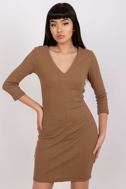 Elegant Ribbed Pencil Dress by Rue Paris featuring a model showcasing the long sleeves and deep heart neckline, perfect for chic evenings out.