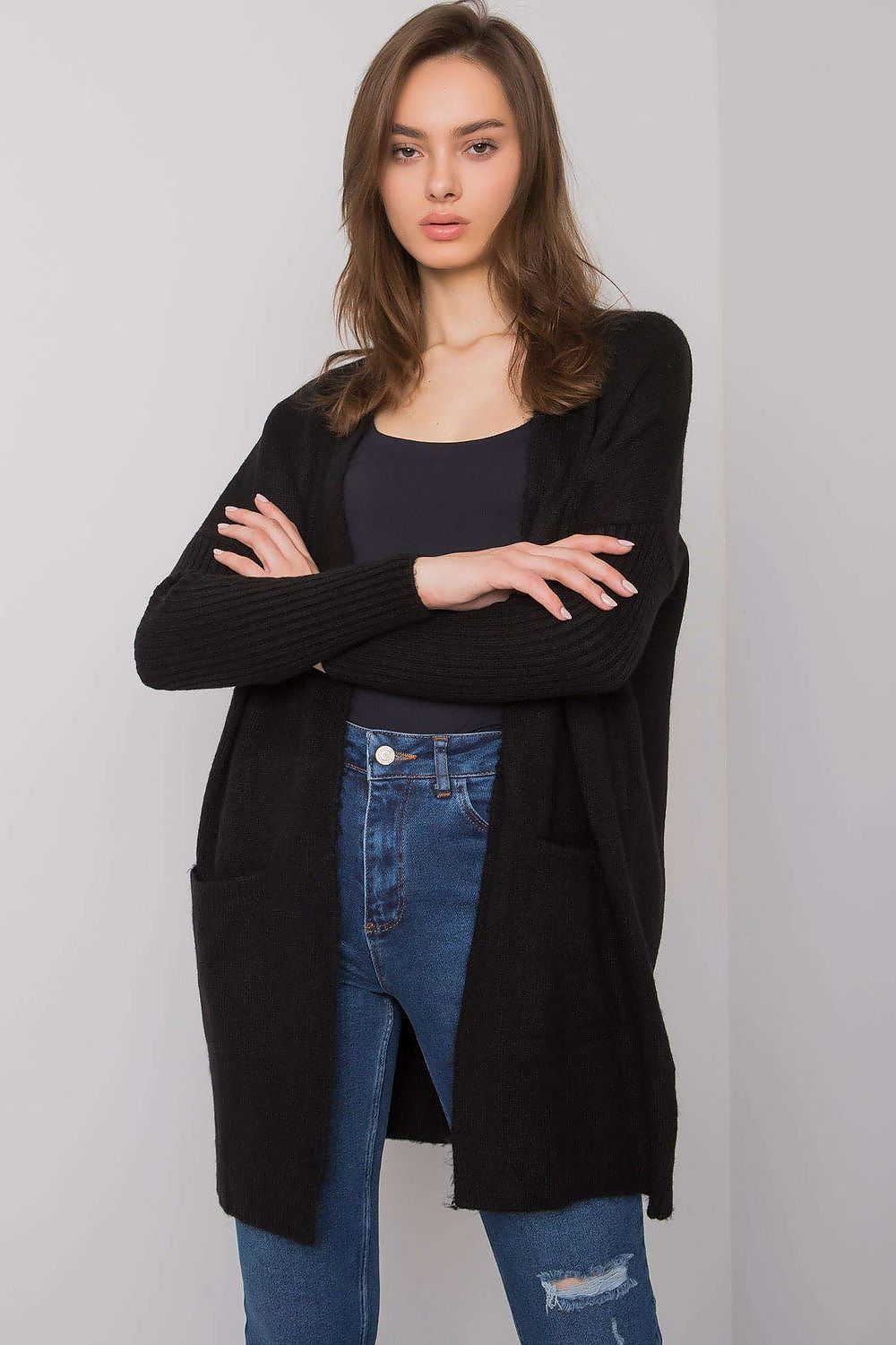Stylish black long-sleeve cardigan by Rue Paris with slip pockets, showcasing modern elegance and crafted from a premium 75% acrylic material.