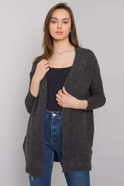 Elegant Long-Sleeve Cardigan With Pockets by Rue Paris, style featuring a classic silhouette and a luxurious grey hue, modelled with contemporary denim.