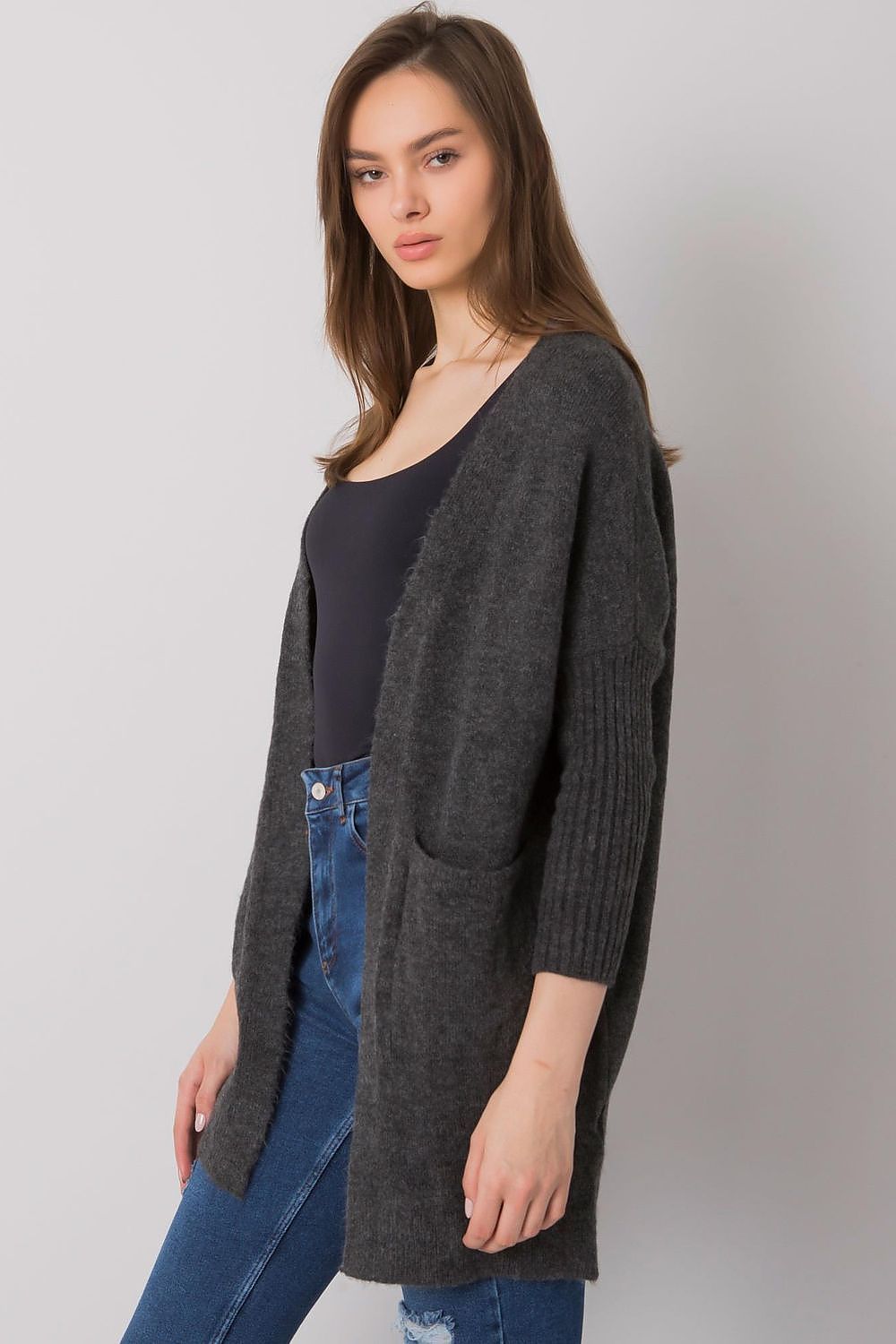 Elegant Long-Sleeve Cardigan With Pockets by Rue Paris, depicted in a classic ensemble, highlighting the soft fabric and relaxed fit, perfect for elegant layering.