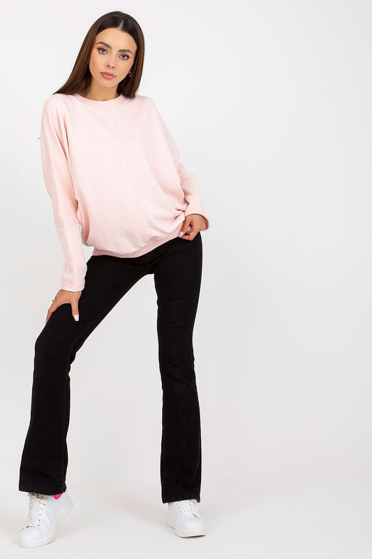 Luxurious Women's Loose Fit Cotton Spandex Sweatshirt with Round Neckline by Rue Paris, showcased in a delicate pink shade, elegantly styled with black flared trousers.