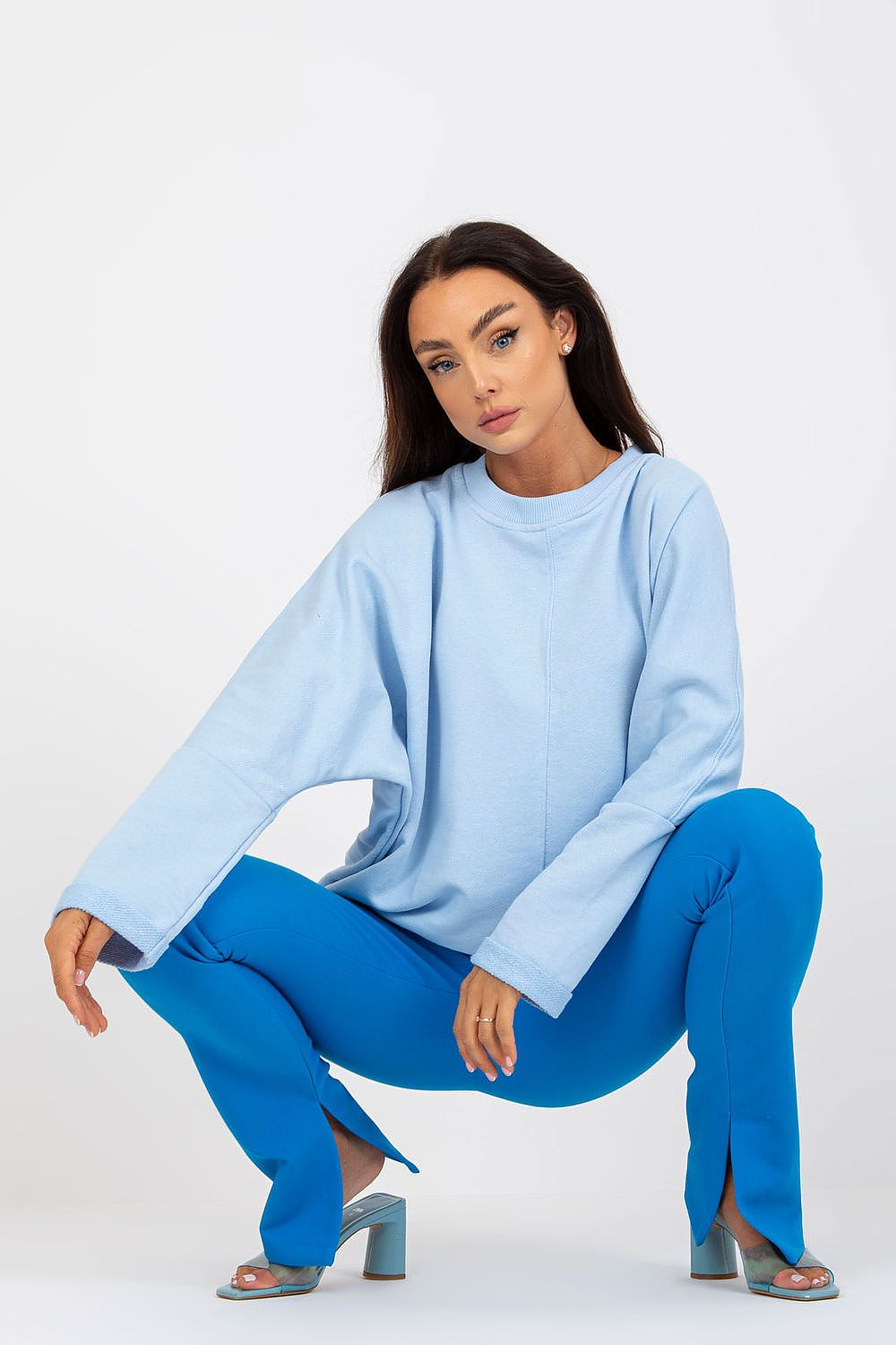 Chic approach to style featuring Women's Loose Fit Cotton Spandex Sweatshirt with Round Neckline by Rue Paris in a refined light blue, complemented by vibrant blue trousers.